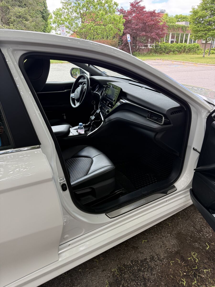 Toyota Camry front passenger area with door open